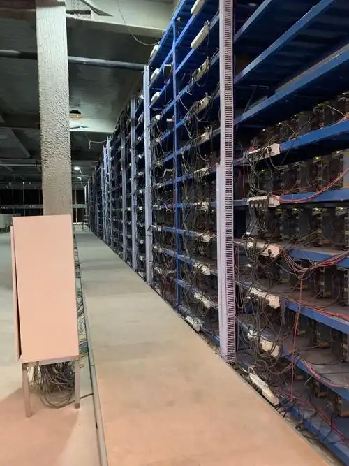 Large-scale mining farm with rows of mining rigs under advanced cooling system