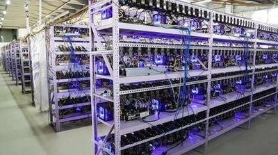 A modern mining farm with rows of mining rigs and advanced cooling systems